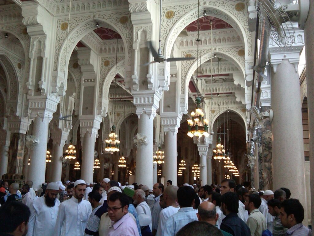 Visitors worshipping in the inner arcades of Masjid al-Haram
