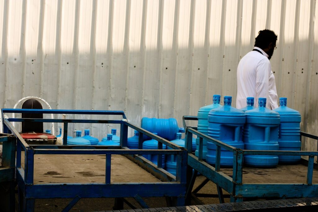Zamzam water containers being prepared for distribution in Makkah